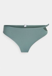 Žalias bikini apatinis trikotažas su lygiu paviršiumi, vidutiniu dengimu ir šoninėmis angomis. Savybėje yra etiketė ant juosmens, minimalistiškas dizainas.