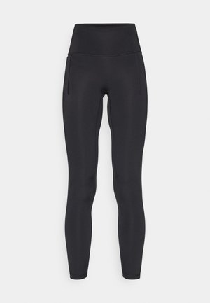 Black high-waisted leggings made of stretchy fabric. Features a smooth texture, slim fit, and side pockets for convenience.