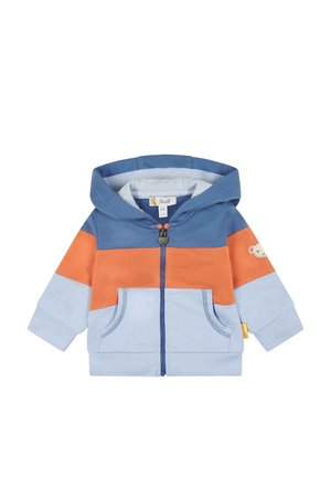 Veste à capuche zippée en coton bleu, orange et bleu clair. Comprend deux poches à l'avant, des poignets côtelés et un emblème d'ours sur la manche.