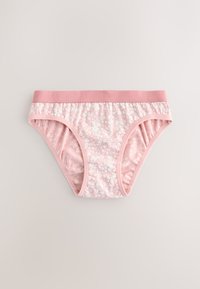Culotte en coton rose clair avec motif floral blanc, taille élastique et côtés froncés pour un ajustement confortable.
