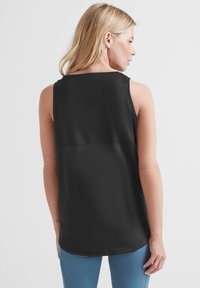 Black sleeveless top with a smooth texture, rounded neckline, and a straight hem, featuring a slight curvature at the back.