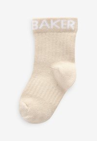 Beige Sock mit geripptem Design, mit dem Wort "BAKER" in Weiß am Bündchen. Standard Crew-Länge, weiches Material.