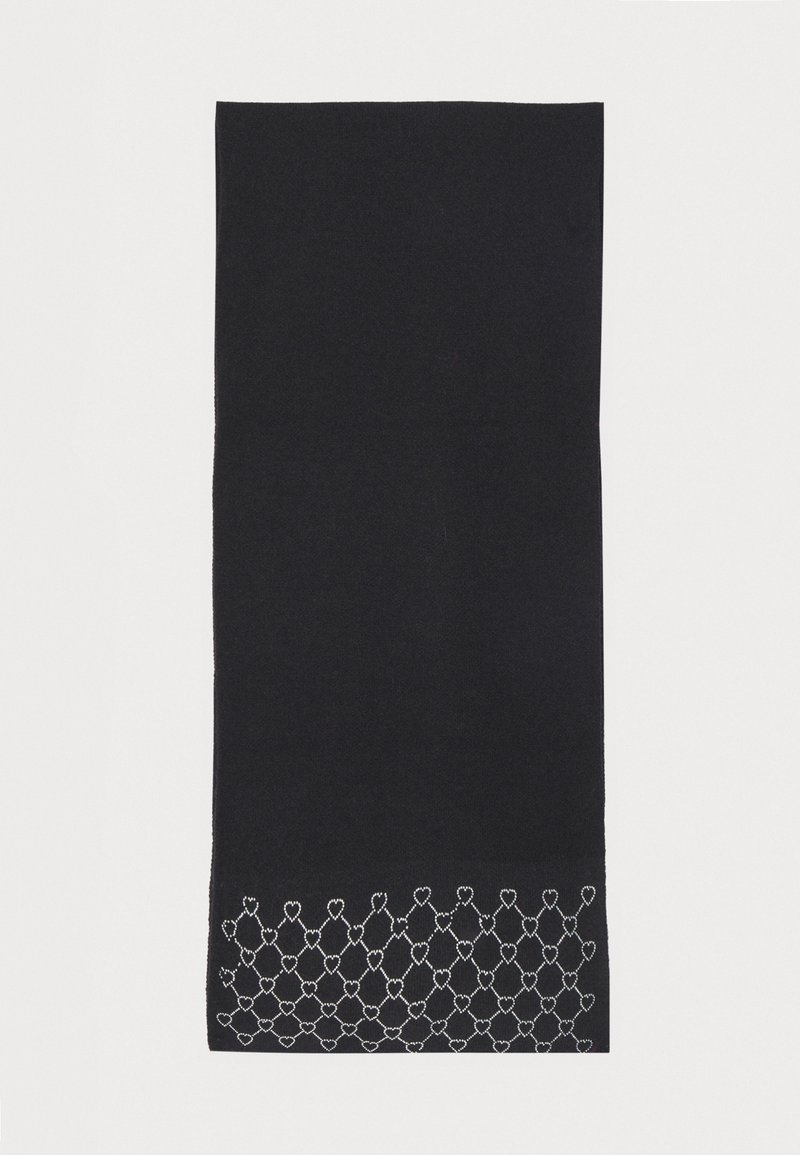 Black scarf made of soft fabric. Features a white heart-shaped embroidered pattern at the bottom edge. Rectangular shape, smooth texture.