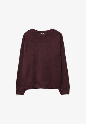 Pulover iz volne v temno burgundski barvi, z okroglo ovratnico in rebrastimi manšetami. Tkani material je mehak z teksturiranim zaključkom. Ohlapen kroj.