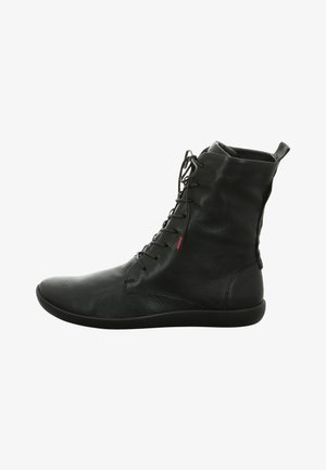 Black leather ankle boot featuring a sleek, smooth texture, round toe, front lacing, and a pull tab at the back for easy wear.