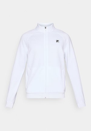 White long-sleeve zip-up jacket with high collar and small black logo on left chest, displayed on plain background.