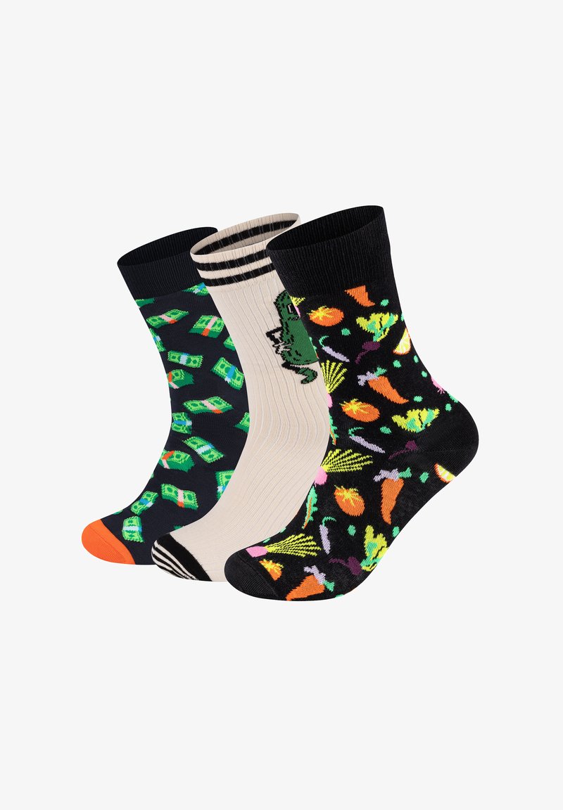 Trzy pary bawełnianych skarpetek: lewa w zielony wzór dolara, środkowa w kremowy z zielonym dinozaurem, prawa w czarne z kolorowymi warzywami.