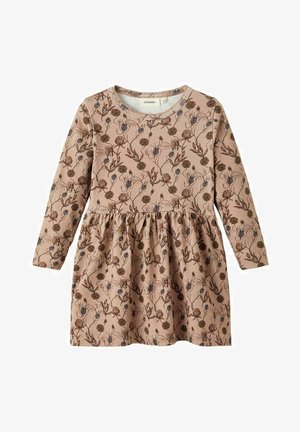 Sukienka z długim rękawem wykonana z miękkiej, jasnobrązowej bawełny z kwiatowym wzorem. Posiada marszczoną spódnicę oraz okrągły dekolt ozdobiony koronką.