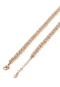 Guldtonet armbånd med klare, runde krystaller i et sammenkoblet design med en lille karabinlås og justerbar kæde til tilpasning af størrelsen.