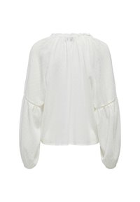 Bílá blůza s dlouhým rukávem, texturovanými tečkami, staženým elastickým výstřihem, objemnými rukávy s krajkovým lemováním a elastickými manžetami, zobrazená zezadu.