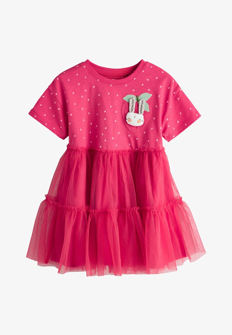 Robe rose vif pour tout-petit avec des pois blancs, manches courtes, jupe en tulle superposée, et un visage de lapin avec des oreilles et une décoration de feuilles vertes sur la poitrine.