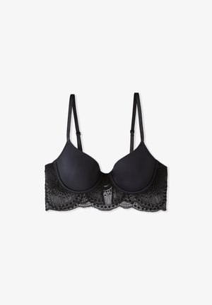 Black padded bra with lace trim. Features adjustable straps, smooth cups, and a scalloped lace edge at the bottom.