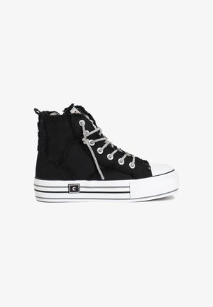 Black canvas high-top sneakers with frayed edges, silver eyelets, and laces. Features a white toe cap and striped black-and-white sole.