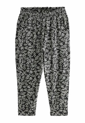 Pantalon noir avec motif floral et oiseau blanc, taille élastique, jambes fuselées et poches latérales.