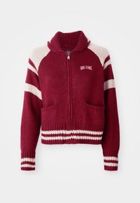 Maroon knitted zip-up sweater with white stripes on sleeves and hem, ribbed collar, two front pockets, and "BDG JEANS" logo on chest.