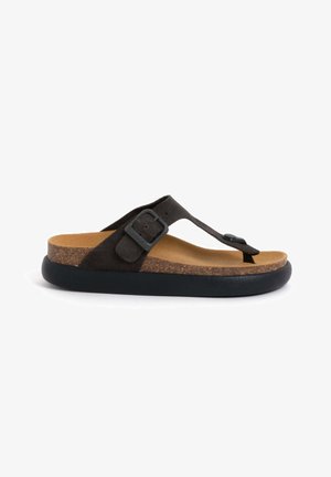 Black suede flip-flop sandal with a cork footbed, textured rubber sole, adjustable strap with a metal buckle, and a sleek design.