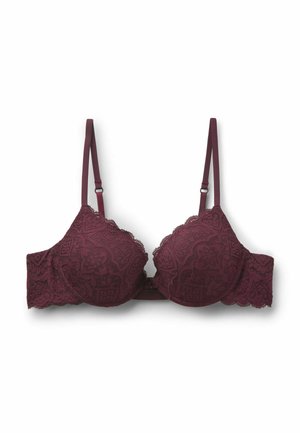 Sujetador de encaje en un profundo color burdeos con bordes festoneados. Tirantes ajustables y detalle de patrón floral intrincado en las copas. Ligeramente acolchado.