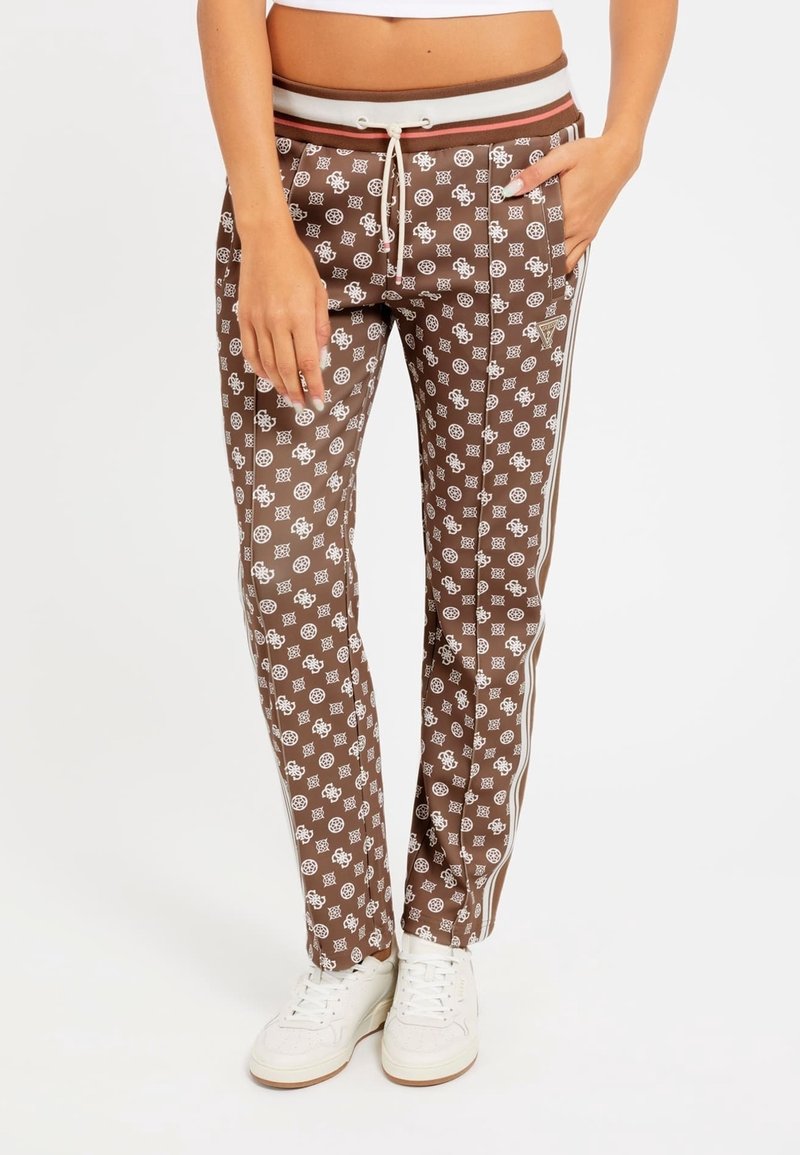 Brown patterned jogger pants with white designs, elastic waistband, drawstring, side pockets, and white stripes down the sides.