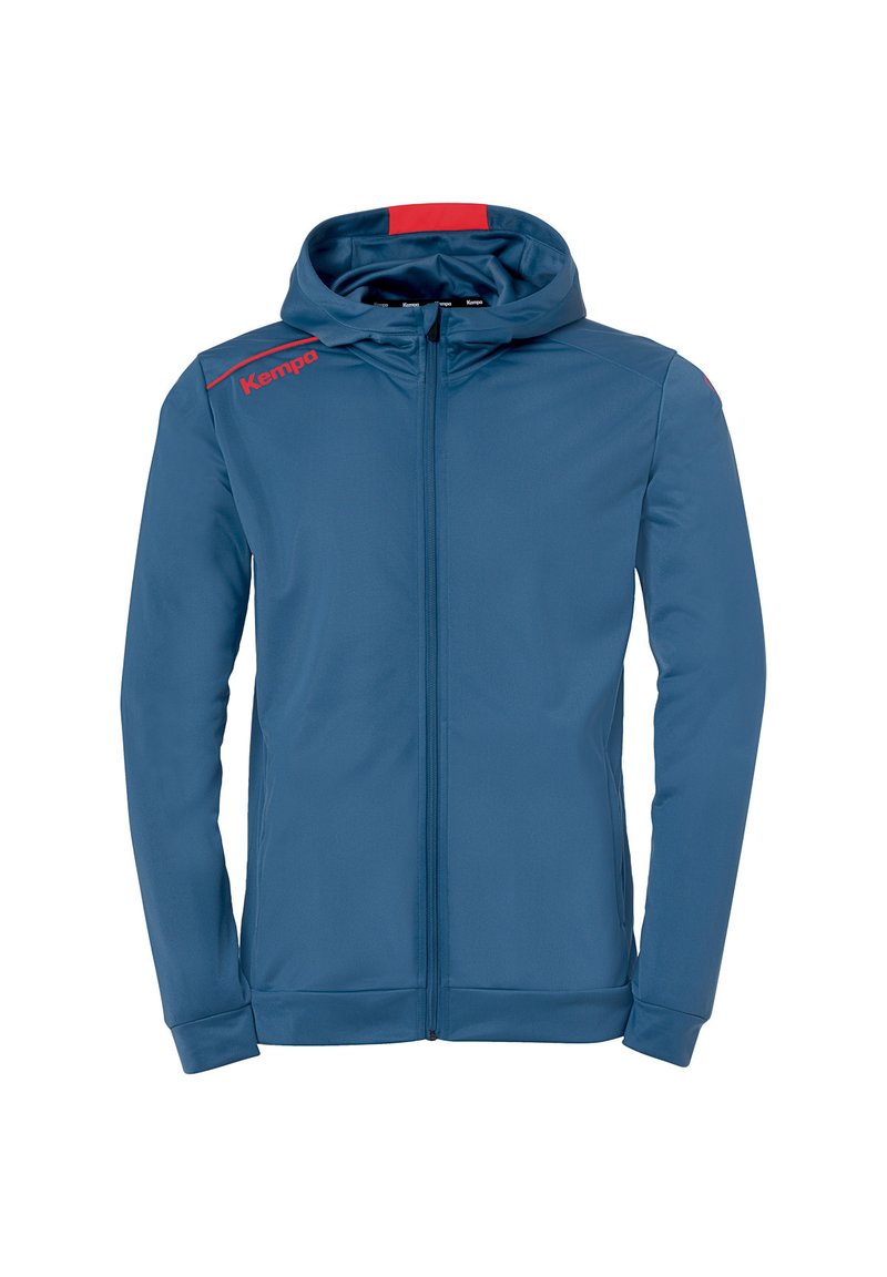 Haut à zip bleu en tissu doux, avec une capuche et des accents rouges. Comprend le logo 'Kempa' en rouge sur l'épaule gauche.