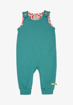 Salopette per toddler turchese in tessuto testurizzato con fodera a motivo di ricci rossi. Caratterizzata da bottoni di legno e polsini elastici alle caviglie.