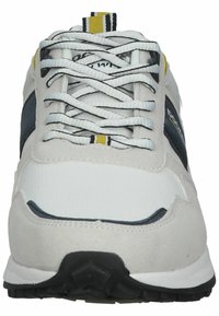 Men’s athletic shoes featuring a white fabric upper with gray suede overlays, black accents, and a textured rubber sole. Laced design with yellow detail.