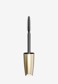 Brosse de mascara noire avec des poils courts et fins, placée dans un contenant doré effilé avec une finition brillante.