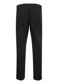 Black pants with a straight leg design, featuring two back pockets and a smooth texture. Made of durable fabric, minimal visible stitching.