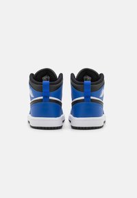 High-top sneakers with a glossy blue leather exterior, black accents, white midsole, and textured black rubber outsole. Features a pull tab.