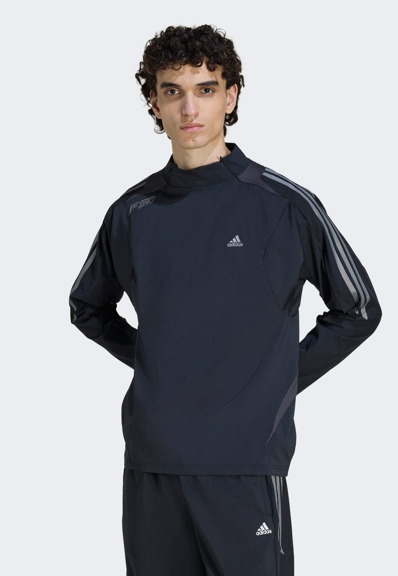 Black athletic top with long sleeves, high collar, and grey accent stripes. Features "F50" logo on shoulder and Adidas emblem on chest.
