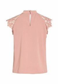 Haut rose blush sans manches avec des manches courtes en dentelle et une découpe en forme de trou-clé au niveau de l'encolure arrière.