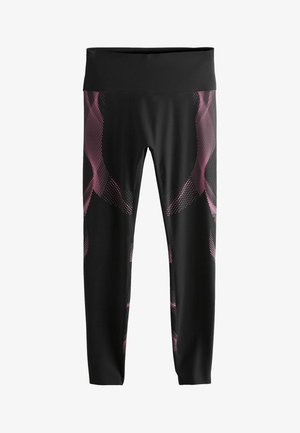Leggings negros con una cinturilla ancha, que presentan un patrón de puntos rosas en los laterales, hechos de una tela suave y elástica para mayor comodidad.