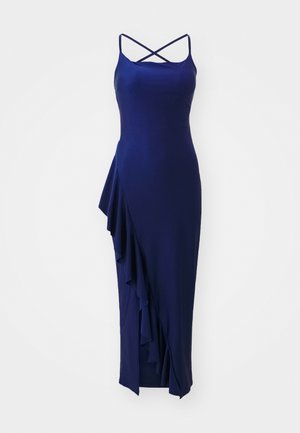 Donkerblauwe midi-jurk van een gladde stof met gekruiste spaghettibandjes en asymmetrische ruffles aan één kant.