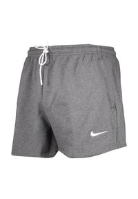 Pantalones cortos atléticos grises hechos de una tela suave, con un cordón blanco y un pequeño logo de Nike en blanco en la pierna izquierda.