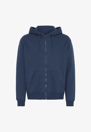 Sötétkék cipzáras kapucnis pulóver, puha anyagból. Kétrészes kapucni, két elülső zseb, bordázott mandzsetták és alsó szegély. Egyszerű kialakítás.