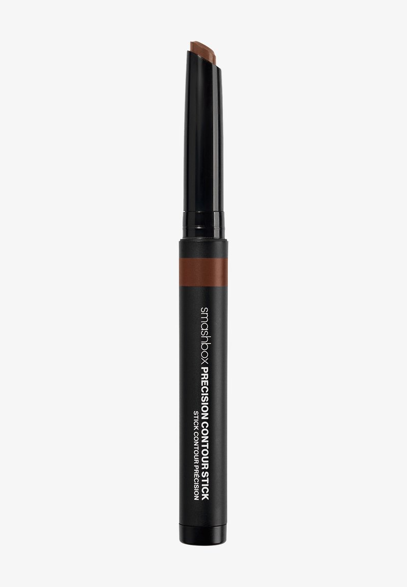 Bâton noir avec une pointe de précision, accompagné d'un crayon contour brun foncé. Le produit est étiqueté en texte blanc sur le manche.