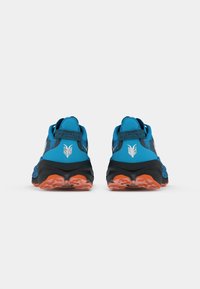 Blue running shoes with a textured upper, black sole, and orange accents. Features a logo on the heel and a padded collar for comfort.