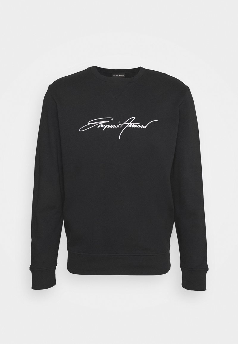 Svart sweatshirt i bomull med rund halsringning och långa ärmar. Har en vit signaturlogga över bröstet.