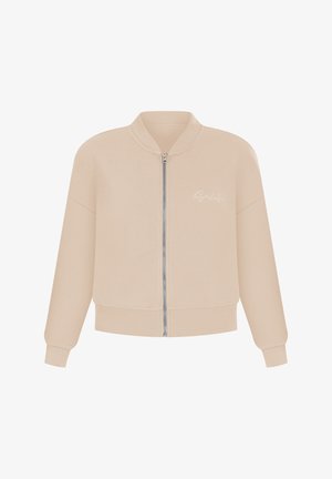 Beżowa bomberka zapinana na zamek z prążkowanym kołnierzem i mankietami. Posiada małe logo w jasnym kolorze na lewej piersi. Miękki materiał.