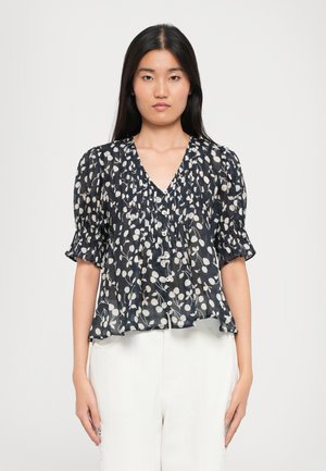 Navy blouse with white floral pattern, puff sleeves, v-neckline, and button closure. Made of lightweight, semi-sheer fabric. Flowy design.