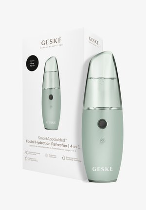 Gezichtsbevochtigingsverfrisser met transparante bovenkant, groene behuizing, twee knoppen en witte doos met productnaam en kenmerken.