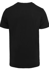Zwarte katoen t-shirt met een ronde hals en korte mouwen, weergegeven vanuit de achterkant met een gladde textuur en zonder zichtbare graphics.