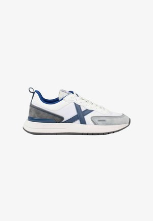 White and gray athletic sneaker with blue accents, lace-up design, padded collar, and a white cushioned sole shown from the side.