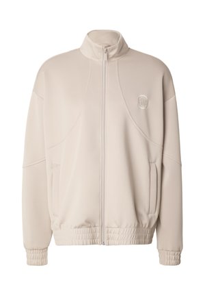 Světlá béžová bunda na zip s vysokým límcem, elastickými manžetami a lemem. Má přední kapsy a kulaté logo na hrudi. Hladká tkanina.