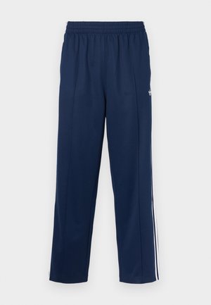 Navyblauwe sportbroek met een gestructureerde afwerking, elastische tailleband en witte zijkstrepen. Heeft een rechte snit en geen zakken.