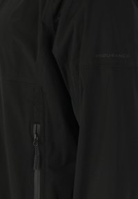 Endurance KOMINT - Runningjack -  black