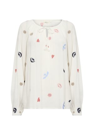 Vit blus med långa ärmar, texturerad tyg, knytning vid halsen och färgglad broderi av hjärtan, fåglar, solar och ögon i rosa, blått, svart och beige.