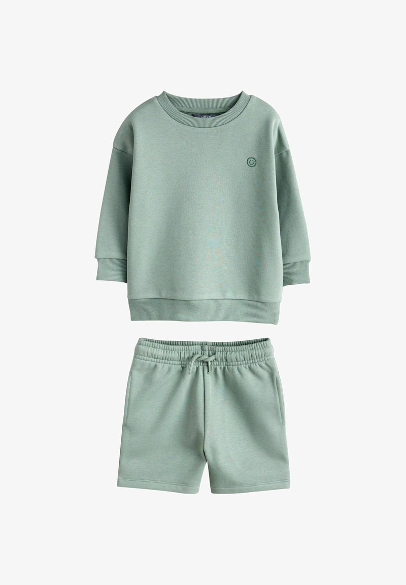 Sweat-shirt vert clair pour enfants avec emblème visage souriant et short assorti à taille élastique avec cordon, ensemble décontracté.