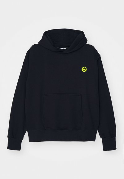 Black hooded sweatshirt made of cotton, featuring a front pocket and a small green paw print logo on the left chest.