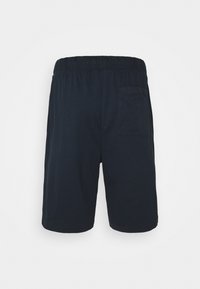 Navy blauwe katoenen shorts met een elastische tailleband en zijzak. De stof is glad met een ontspannen pasvorm en een ontwerp tot op de knie.