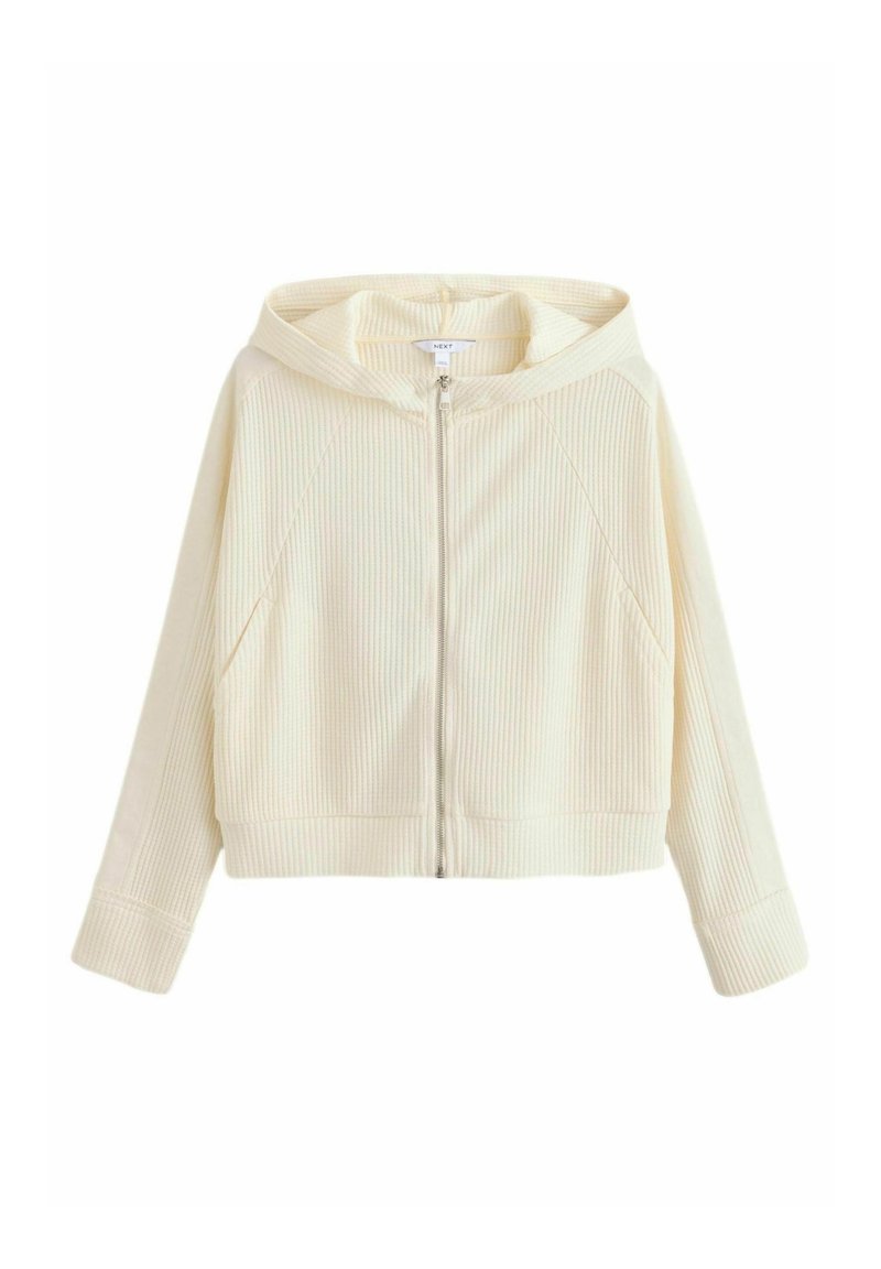 Sweat à capuche zippé côtelé couleur crème avec manches longues et capuche, présenté à plat sur un fond blanc.